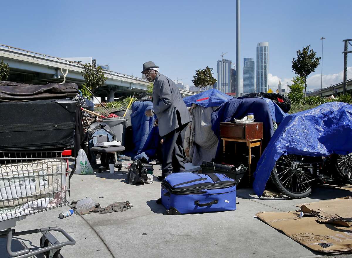 "Chef" the best dressed guy in the Fifth and Bryant Streets encampment Wednesday April 8, 2015. Southern California State Senator Carol Liu has introduced legislation to create a "right to rest" law which would wipe out San Francisco's sit-lie law and legalize tent camps.