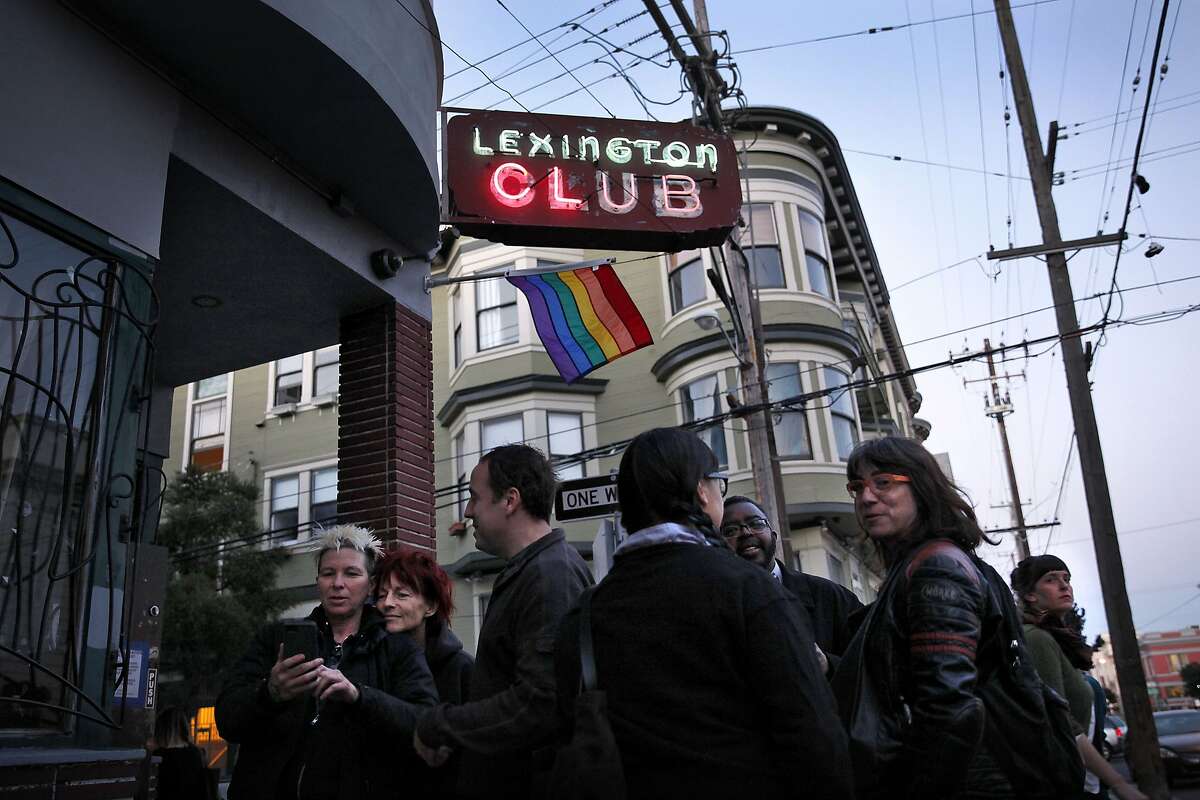People stand outside the Lexington Club, a neighborhood lesbian bar in San Francisco, Calif., on Thursday, April 2, 2014. The bar is closing after 18 years in the Mission.