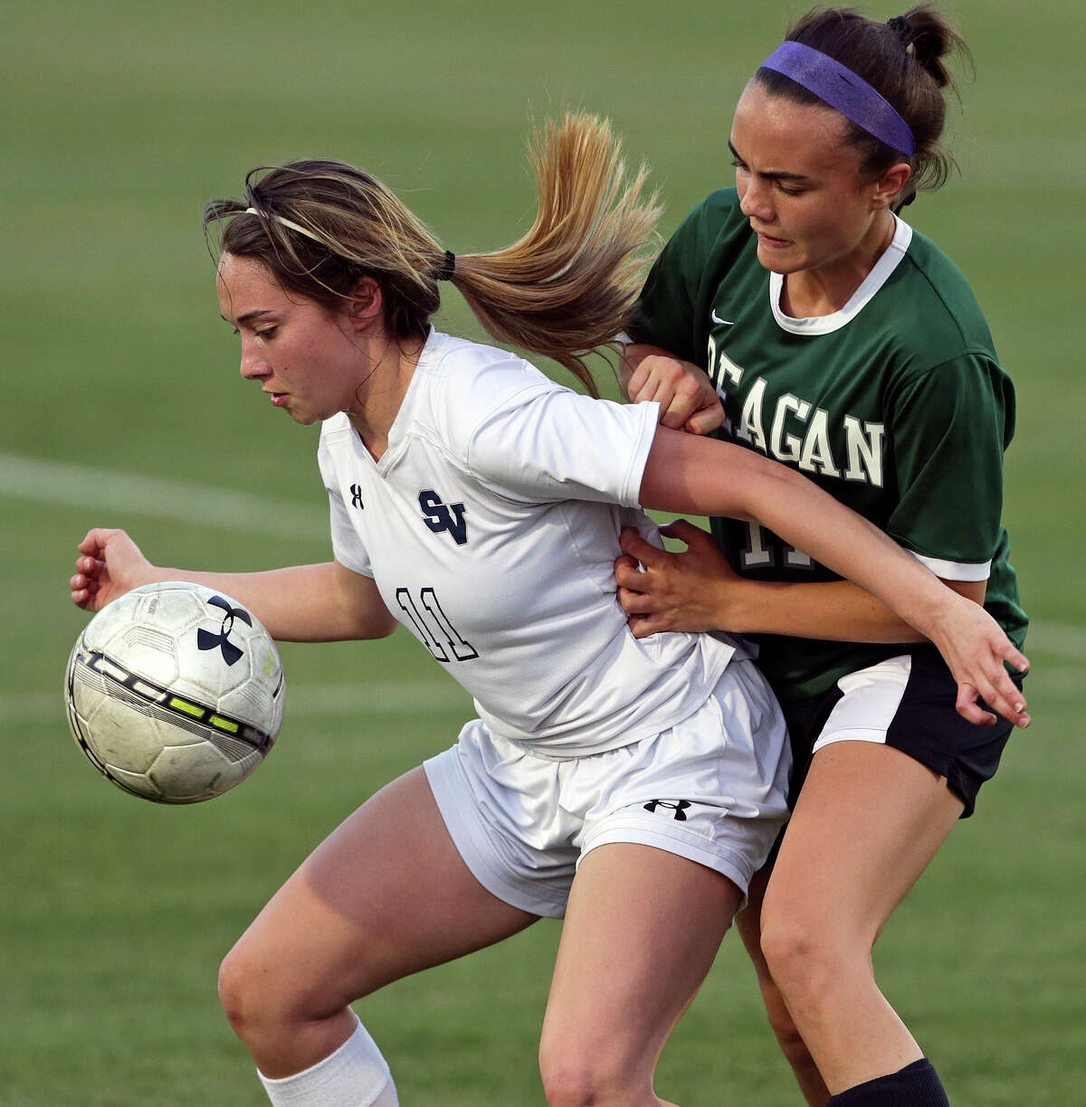 The Rangers' Gabby Rodriguez protects the ball against Kristi Gambuti as the Reagan girls beat Smithson Valley 1-0 in third round 6A soccer playoffs at the UTSA Park West Complex on April 7, 2015.