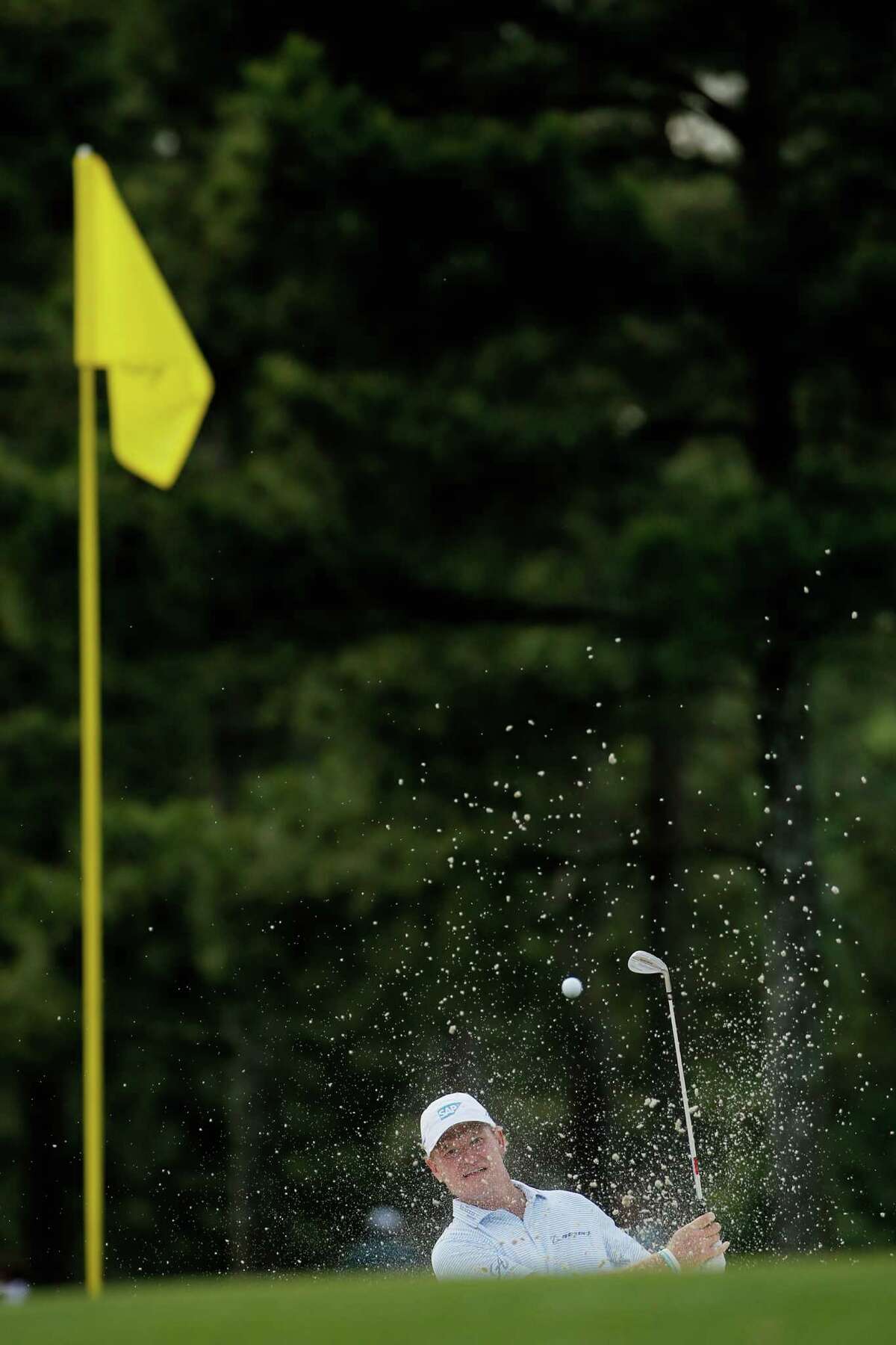 Ernie Els of South Africa plays a bunker shot on the 17th hole during the first round of the 2015 Masters Tournament at Augusta National Golf Club on April 9, 2015, in Augusta, Ga.