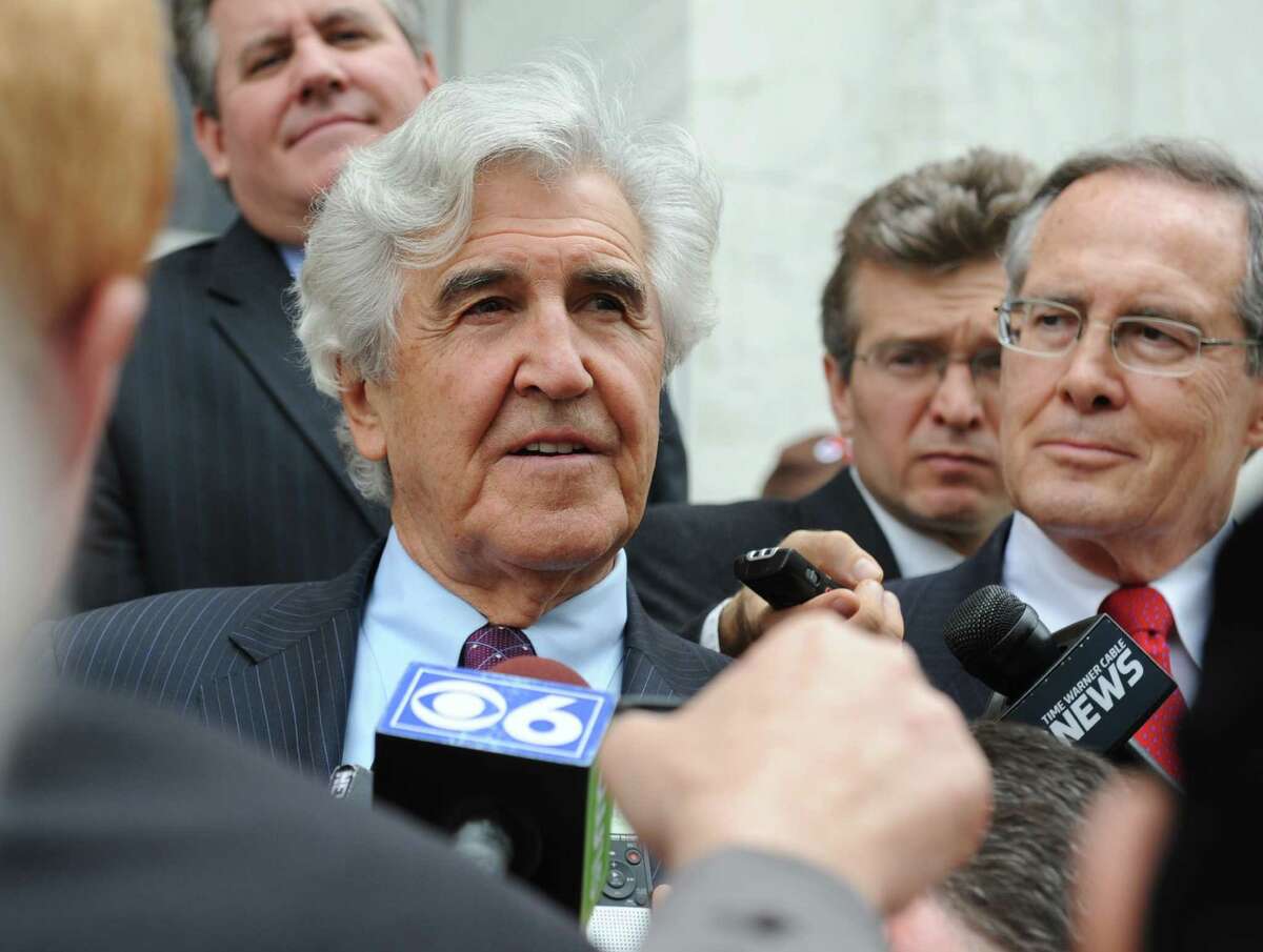 Former State Senate Majority Leader Joseph Bruno talks to the media outside the James T. Foley U.S. Courthouse following Bruno's not guilty verdict on federal corruption charges Friday, May 16, 2014, in Albany, N.Y. Defense attorney E. Stewart Jones smiles at right. (Lori Van Buren / Times Union)