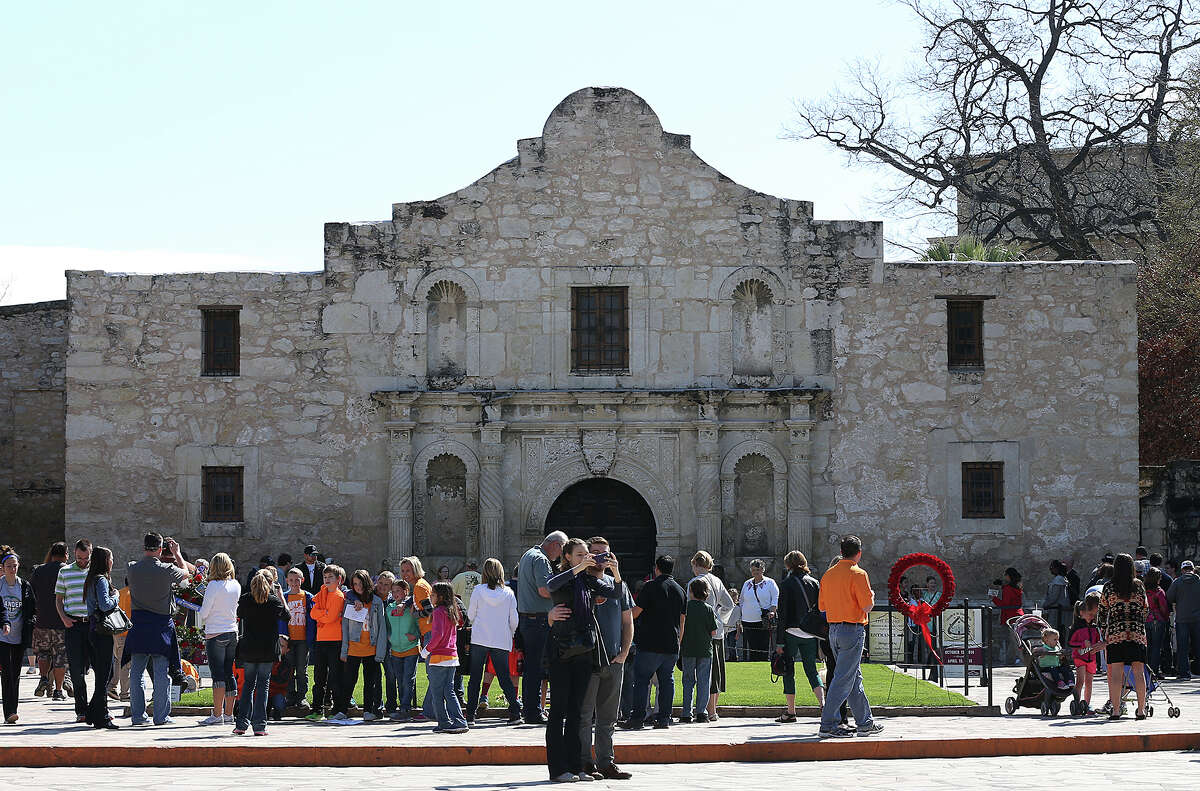 A Spring Break crowd gathers in front of the Alamo, Thursday, March 12, 2015.