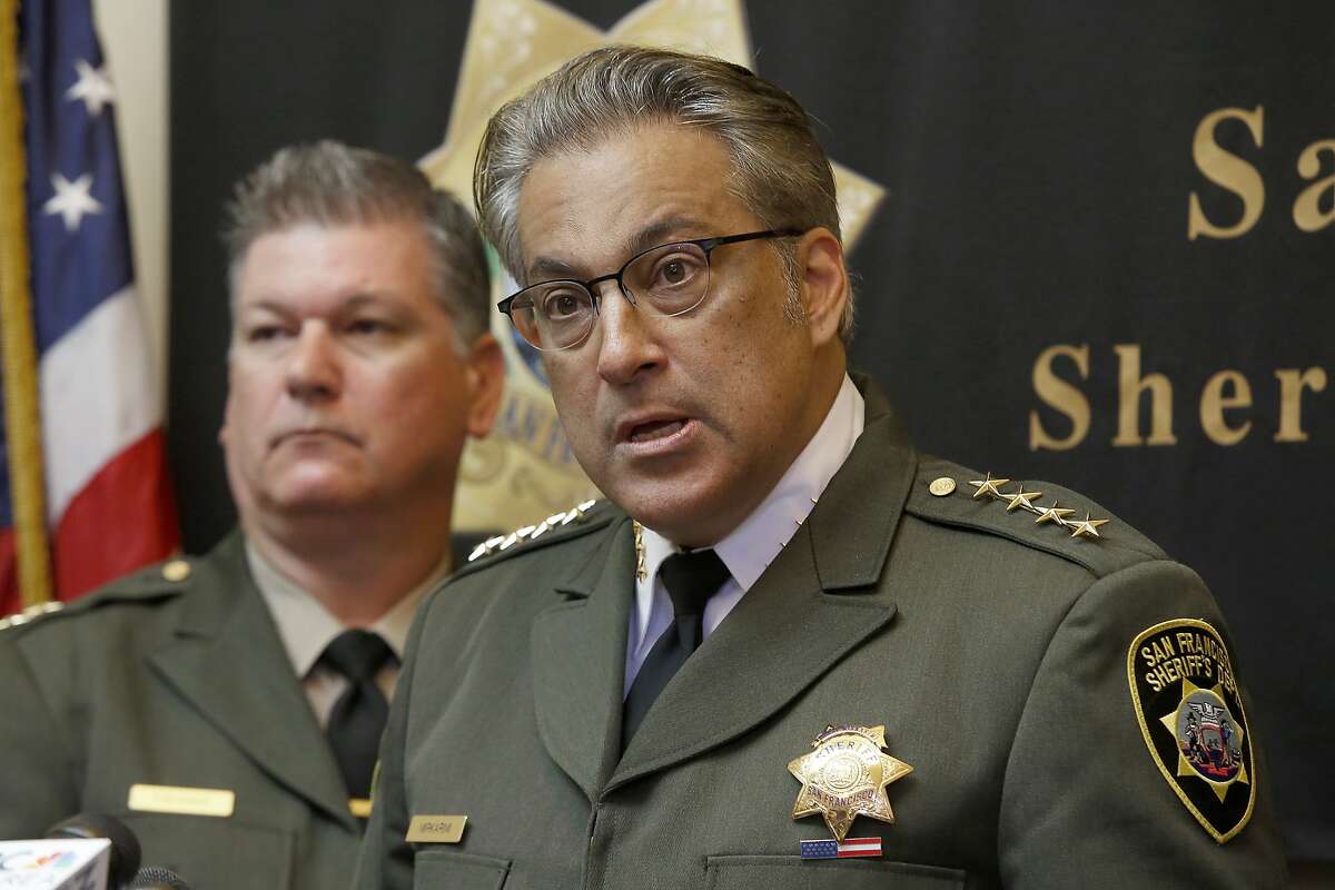 Sheriff Ross Mirkarimi (right) holds a press conference surrounded by chief deputies including Matt Freeman (left) regarding investigations on the recent inmate escape in his office at City Hall in San Francisco, California, on Friday, April 10, 2015.