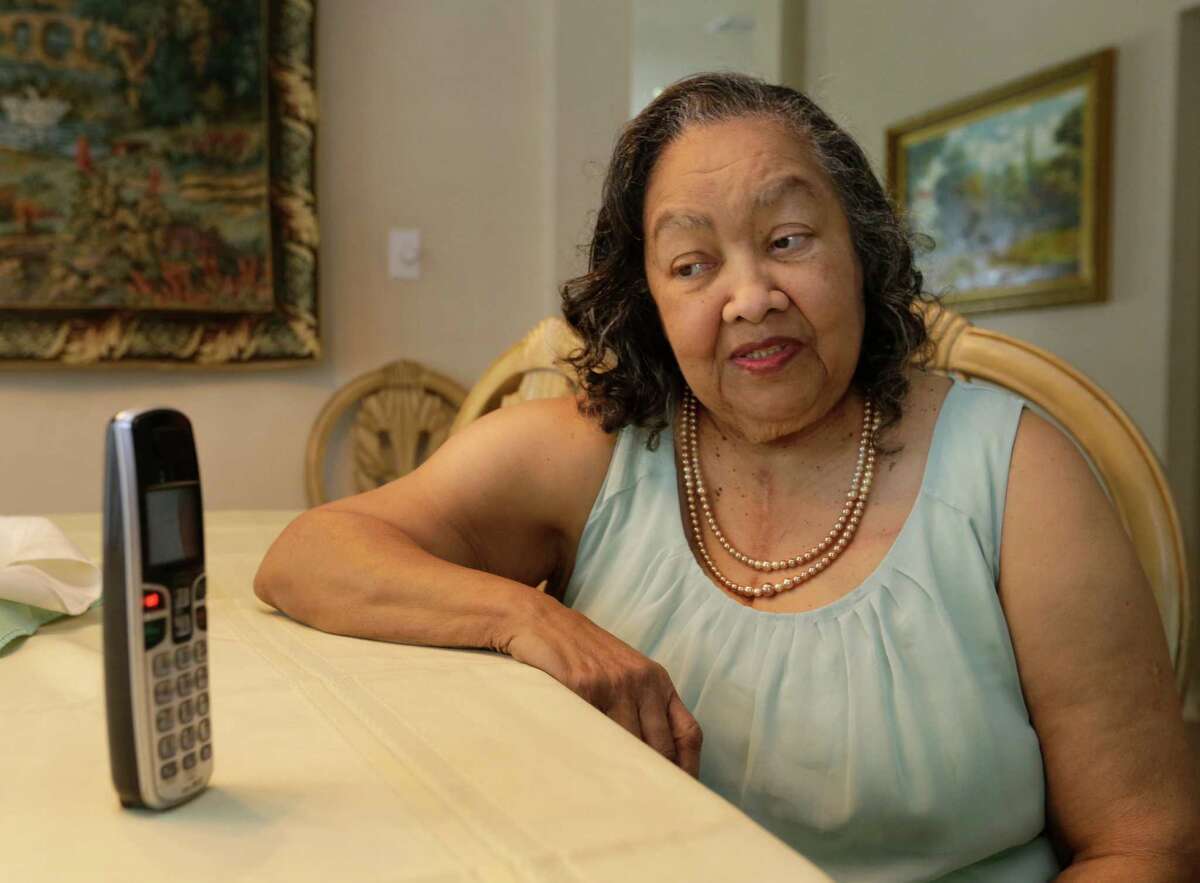 Odelia Wilson, 84, who has congestive heart failure, speaks on the phone to a pharmacist as part of a patient follow-up with Houston Methodist. ﻿