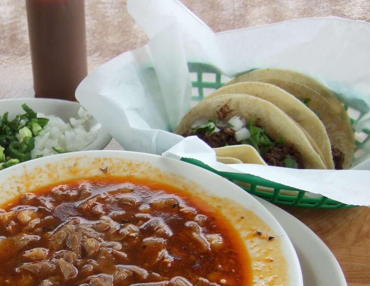 Tacos made with barbacoa - made the old-fashioned way with whole cow heads at Gerardo's Drive-in in Houston - are shown with another traditional Mexican dish, menudo, a soup made with cow stomach.