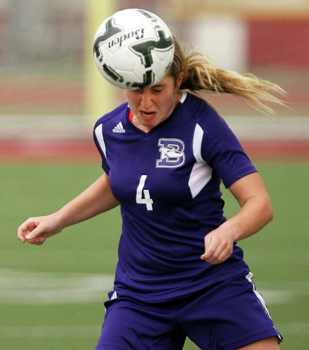 Boerne's Alexandra Chapman, 4, heads the ball in a in a 4A regional semifinal game against Kingsville April 10, 2015 in Mission.