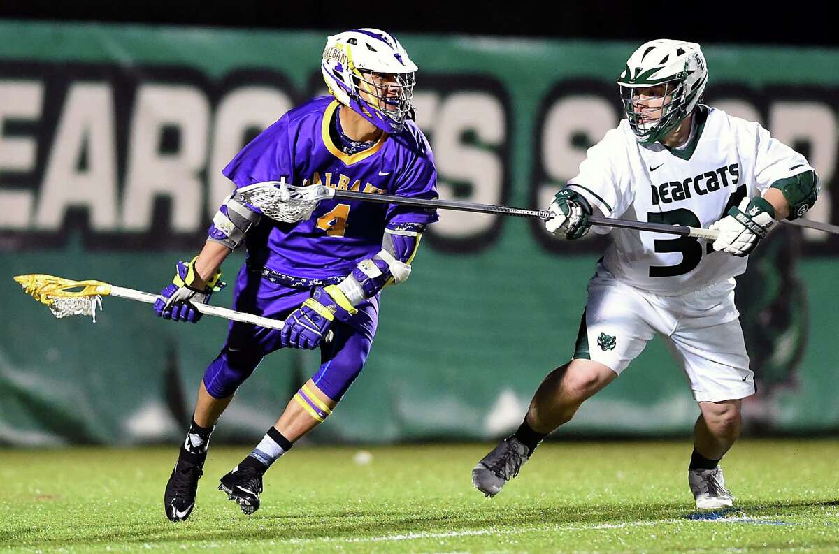 Lyle Thompson of UAlbany goes up against the Binghamton defense on Saturday, April 11, 2015. Thompson had a goal and six assists in the game to tie the NCAA career scoring record or Cornell's Rob Pannell. (Greg Wall / Special to the Times Union)
