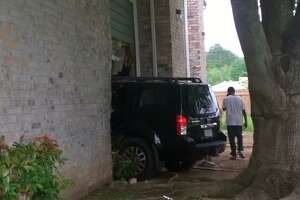 Woman hurt when teen crashes SUV into apartment