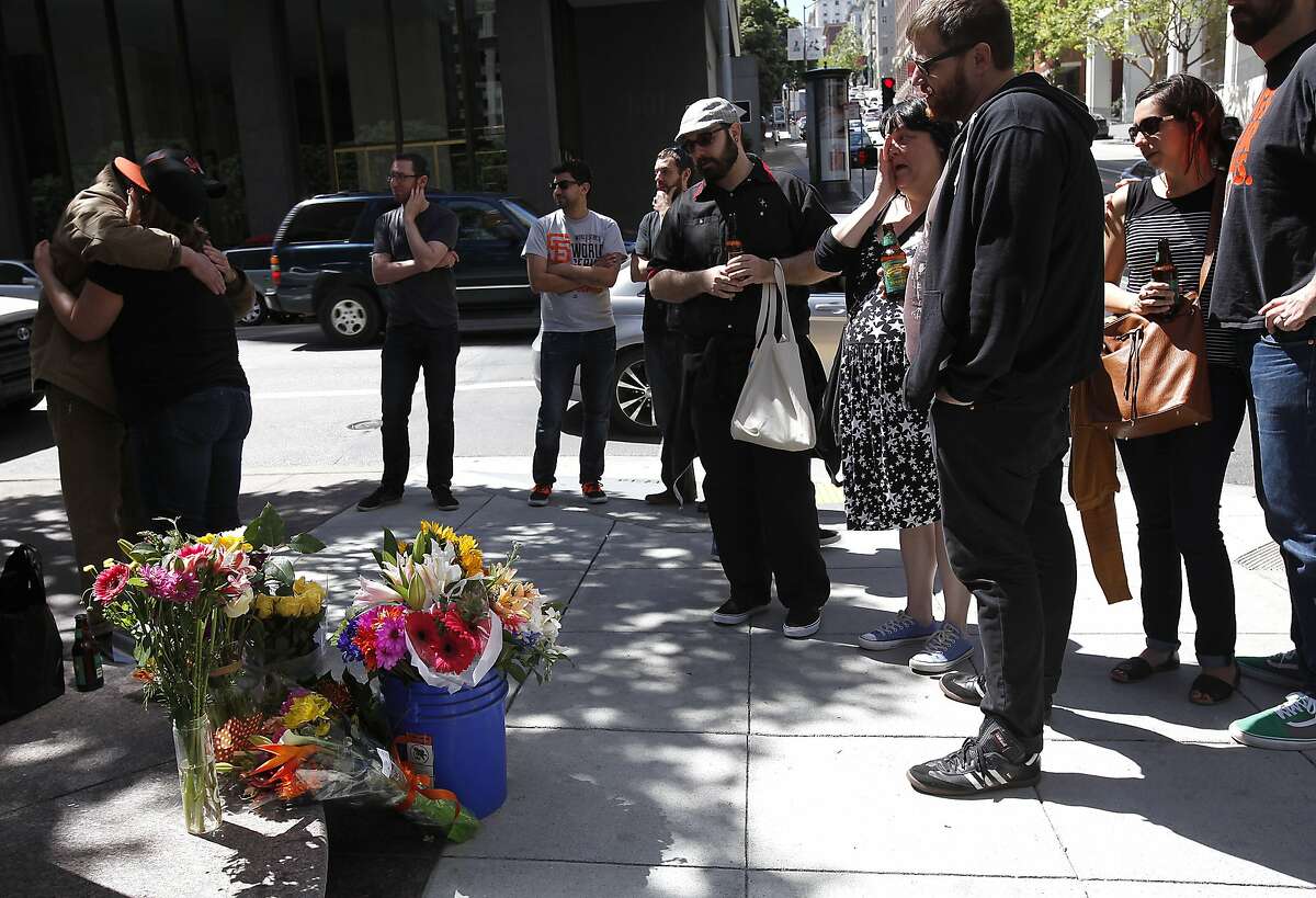 Friends gather at the corner of California St. and Kearny St. during a memorial for Bridget Klecker, who was hit and killed by fleeing armed robbers Friday night in San Francisco, Calif., on Sunday, April 12, 2015.