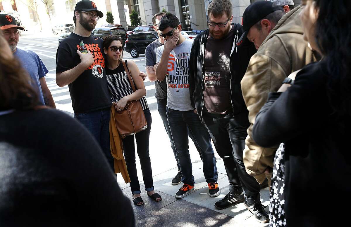 Friends gather at the corner of California St. and Kearny St. during a memorial for Bridget Klecker, who was hit and killed by fleeing armed robbers Friday night in San Francisco, Calif., on Sunday, April 12, 2015.
