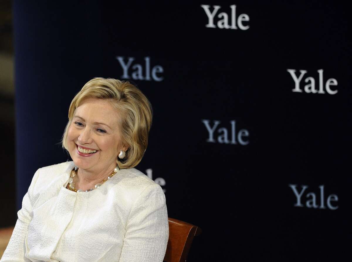 Hillary Clinton waits to be introduced during a Yale Law School ceremony at Yale University, Saturday, Oct. 5, 2013, in New Haven, Conn. Clinton received the Yale Law School Association Award of Merit, which is presented annually to those who have made a substantial contribution to public service or the legal profession. (AP Photo/Jessica Hill)
