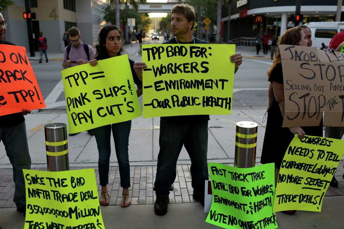 Union members and community activists protest outside the Miami Dade College where the Greater Miami Chamber of Commerce and the college were hosting a moderated conversation with U.S. Secretary of the Treasury Jacob Lew on March 20, 2015 in Miami, Florida. The protesters are against the Trans-Pacific Partnership (TPP) which is a proposed twelve-nation pact and are asking the Federal Government and Florida Congressional delegation to reject fast tracking the TPP and warn that the deal poses serious risk to jobs and wages, the environment, food safety and public health for Floridas working families. (Photo by Joe Raedle/Getty Images)