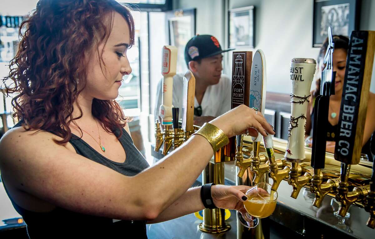 Bartender Kayleigh Bender pours a beer at Liquid Gold in San Francisco, Calif., on Sunday, April 12th, 2015.