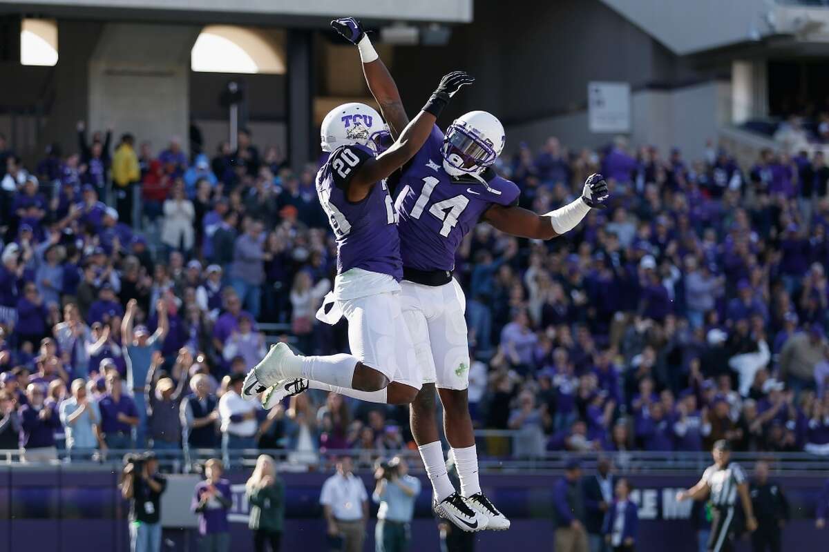 FORT WORTH, TX - DECEMBER 06: Wide receiver Deante' Gray #20 of the TCU Horned Frogs celebrates with David Porter #14 after Gray scored a 45 yard touchdown reception against the Iowa State Cyclones during the third quarter of the Big 12 college football game at Amon G. Carter Stadium on December 6, 2014 in Fort Worth, Texas. (Photo by Christian Petersen/Getty Images)