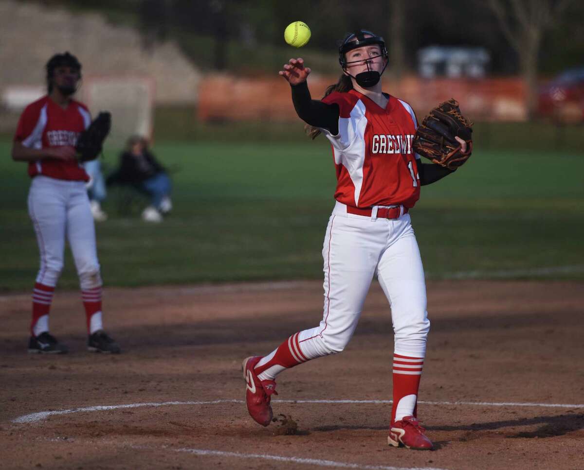 Greenwich pitcher Katie Piro throws a runner out at first base in Greenwich's 7-5 win over Wilton in the high school softball game at Greenwich High School in Greenwich, Conn. Monday, April 13, 2015.