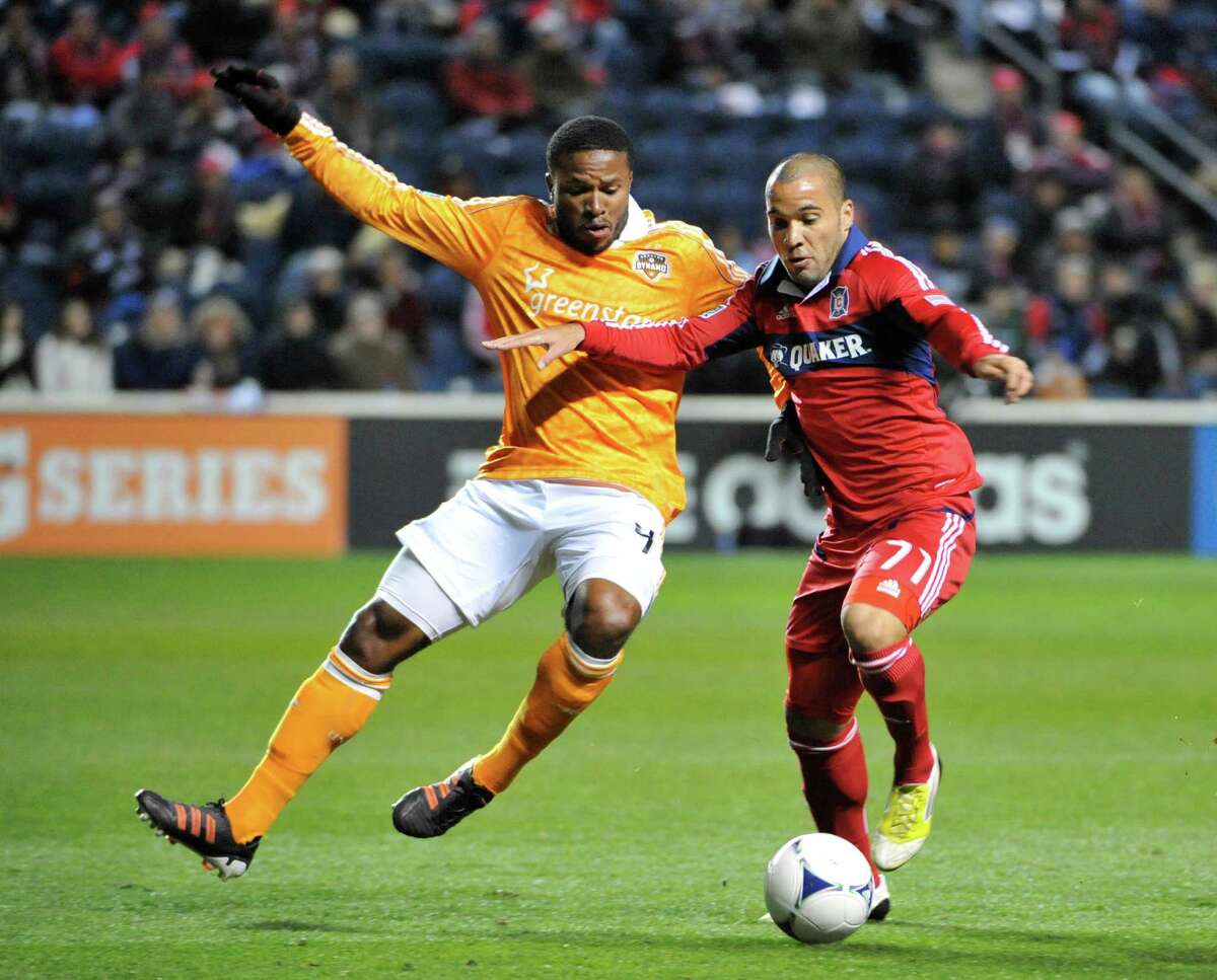 Alex of the Chicago Fire, right, battles the Dynamo's Jermaine Taylor in 2012. Alex, now with the Dynamo, has four goals and two assists in 77 MLS matches.