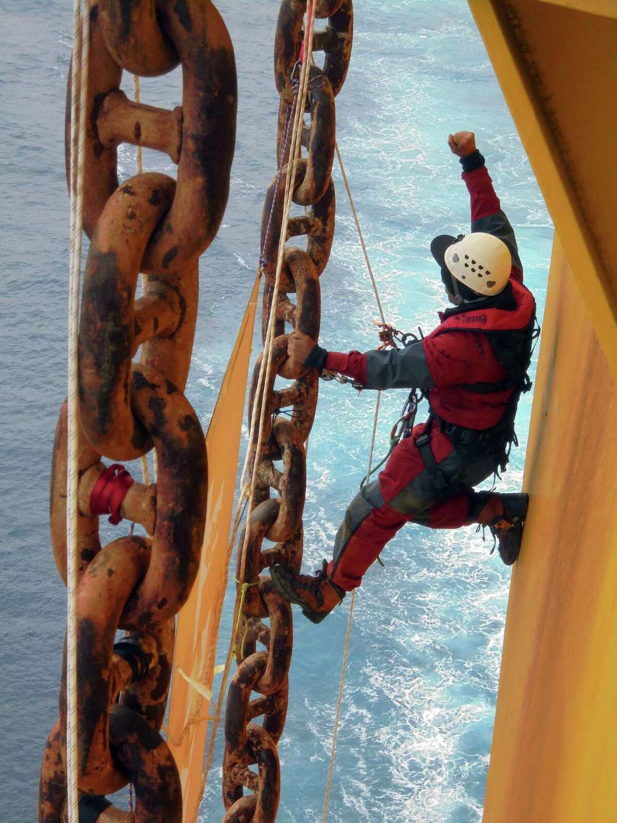 Greenpeace activists rig ropes and set up camp underneath the main deck of Shell's Arctic-bound Polar Pioneer oil rig in the Pacific Ocean last week. A federal judge granted a temporary restraining order blocking Greenpeace from similar protests.