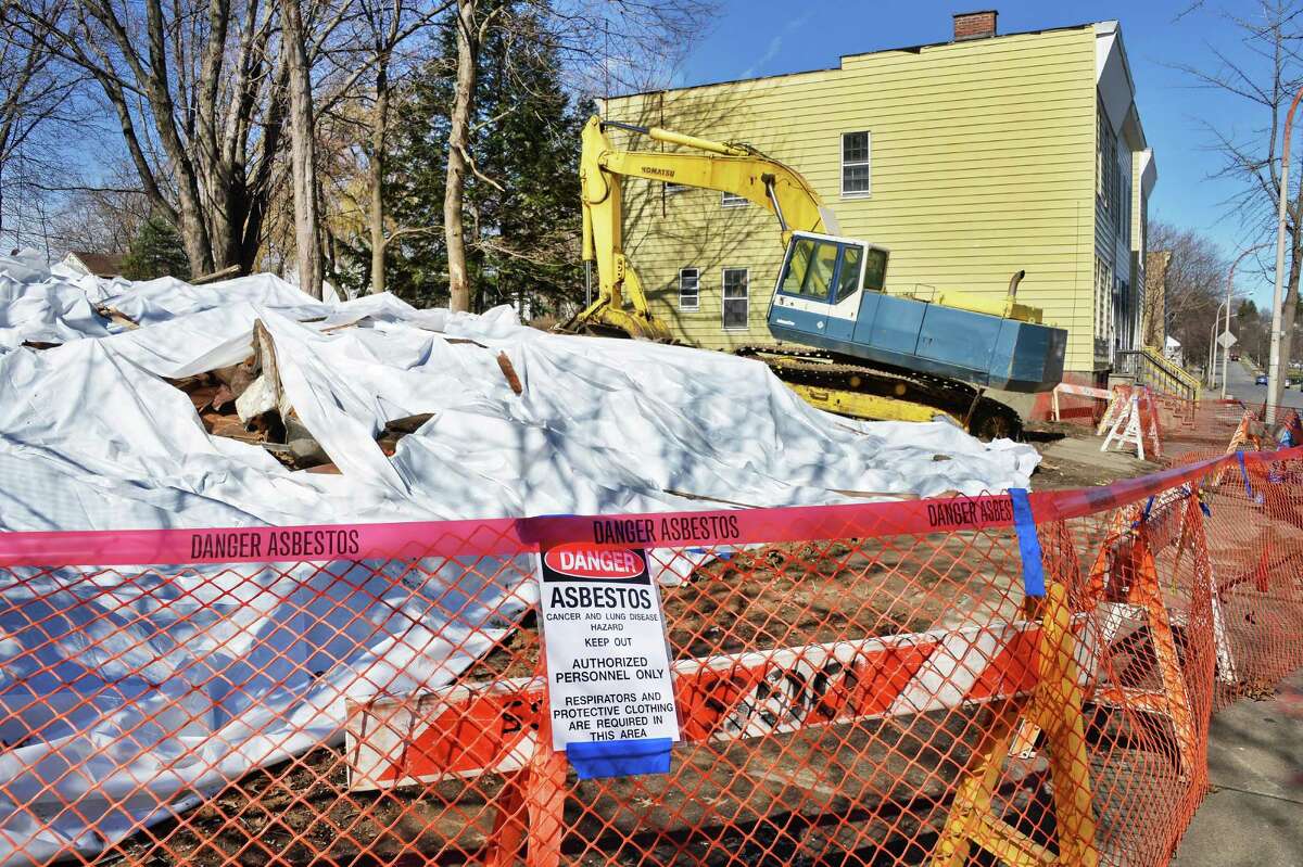 Tarps cover the remains of two collapsed houses on the 200 block of Colonie Street Tuesday April 14, 2015 in Albany, NY. (John Carl D'Annibale / Times Union)