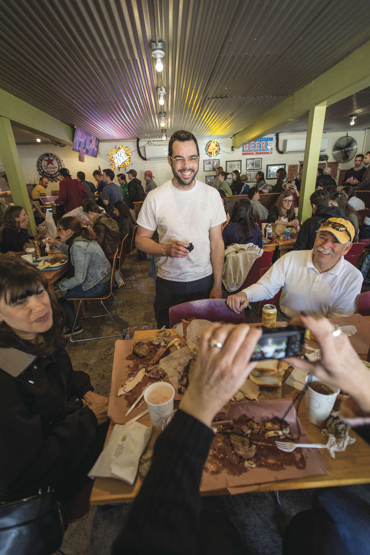 Aaron Franklin with his customers at Franklin Barbecue, Austin. From his new cookbook, "Franklin Barbecue: A Meat-Smoking Manifesto" (Ten Speed Press).