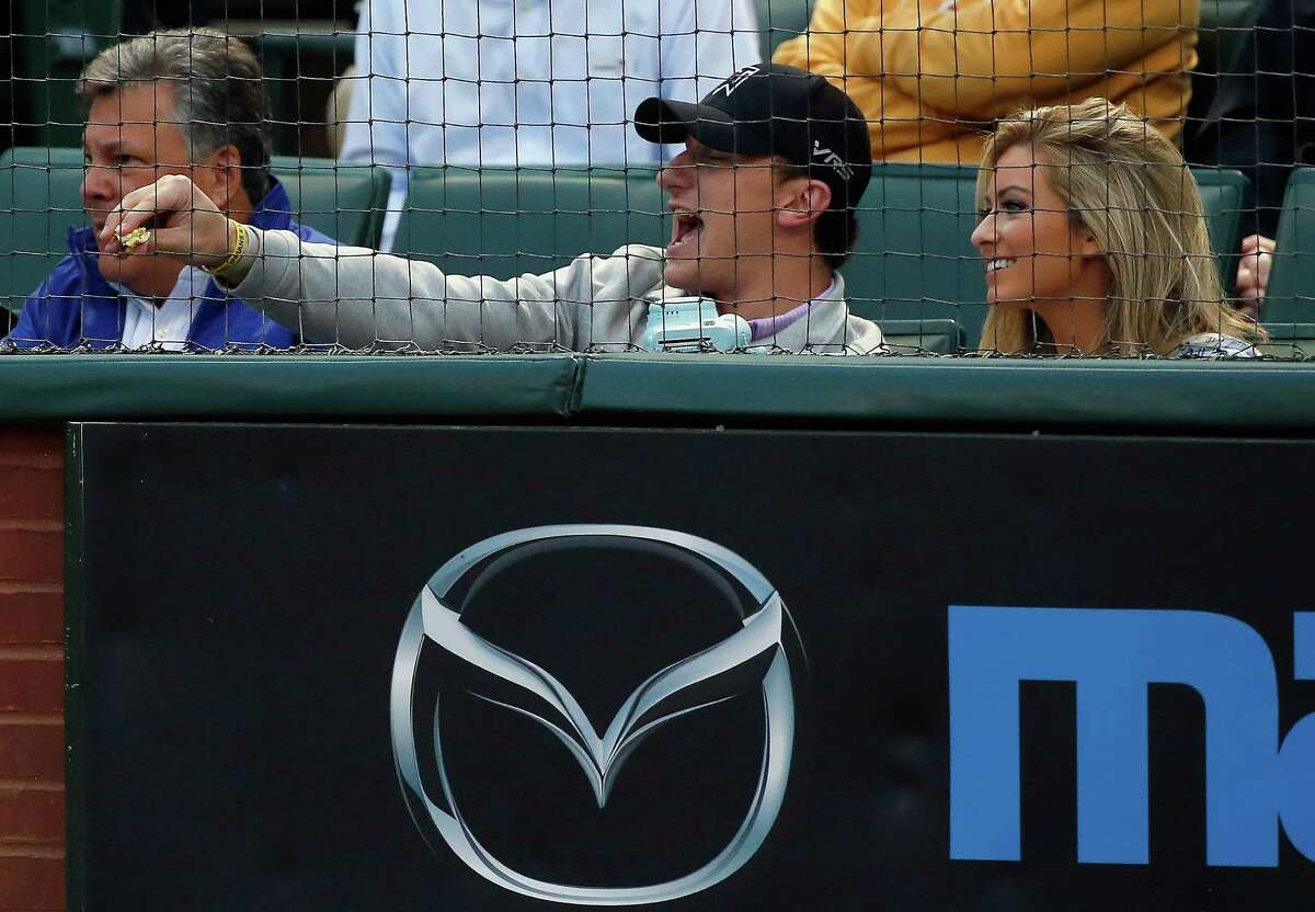 ARLINGTON, TX - APRIL 14: Johnny Manziel quarterback of the Cleveland Browns yells at a player as the Texas Rangers take on the Los Angeles Angels at Globe Life Park in Arlington on April 14, 2015 in Arlington, Texas. (Photo by Tom Pennington/Getty Images)