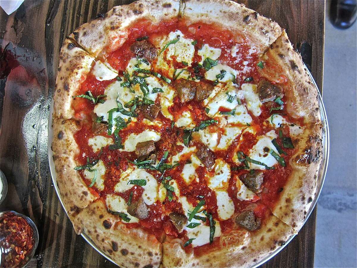 The Polpette pizza is topped with meatballs, ricotta, house-made mozzarella and ﻿Calabrian peppers.