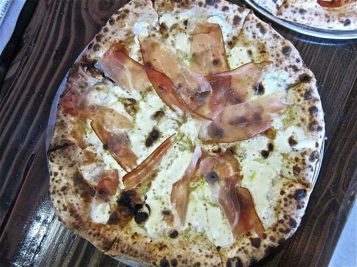 The Fino white pizza with olive oil, garlic, house-made mozzarella and speck (Italian ham) cut translucently thin, at Pizaro's new Montrose location.