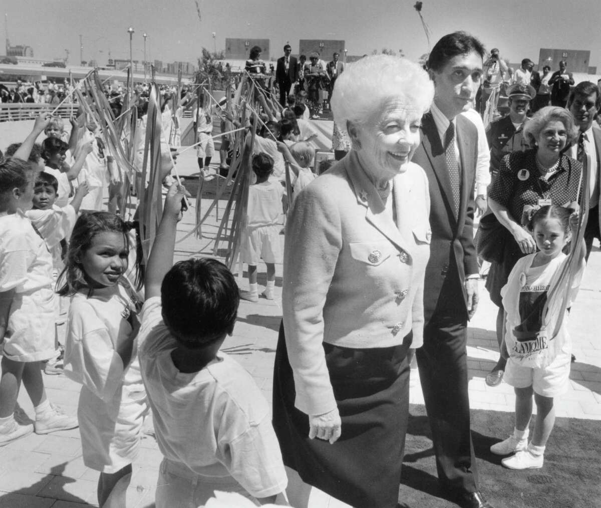Governor Ann Richards walks with HUD Secretary Henry Cisneros at the Alamodome opening ceremonies on May 16, 1993.