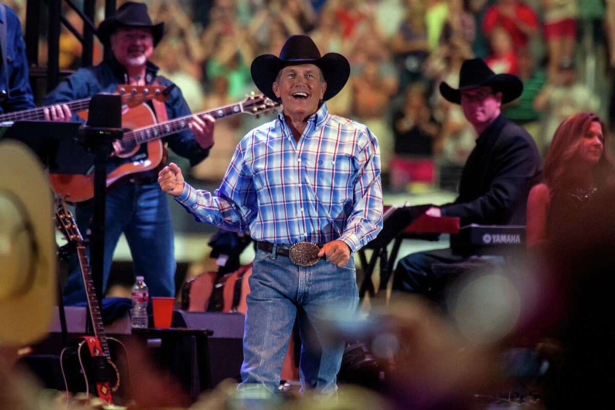 George Strait performs during his farewell tour at AT&T Stadium in Arlington, Texas, Saturday, June 7, 2014. About 105,000 people packed in for the last concert of Strait's final tour —exceeding the stadium's official capacity by 5,000— and shattering the previous record set by The Rolling Stones at The Louisiana Superdome in 1981. (AP Photo/The Fort Worth Star-Telegram, Jamie B. Ford)