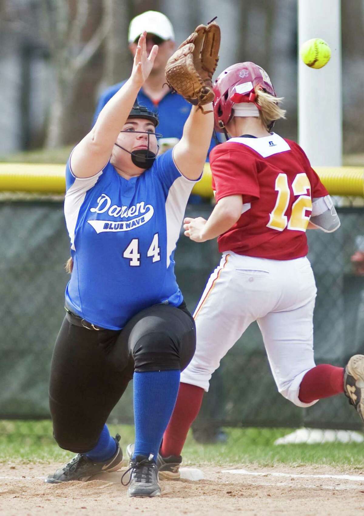 Darien High School's Sophia Barbour tries to get the out at 1st in a game against St. Joseph High School, played at Darien. Wednesday, April 15, 2015