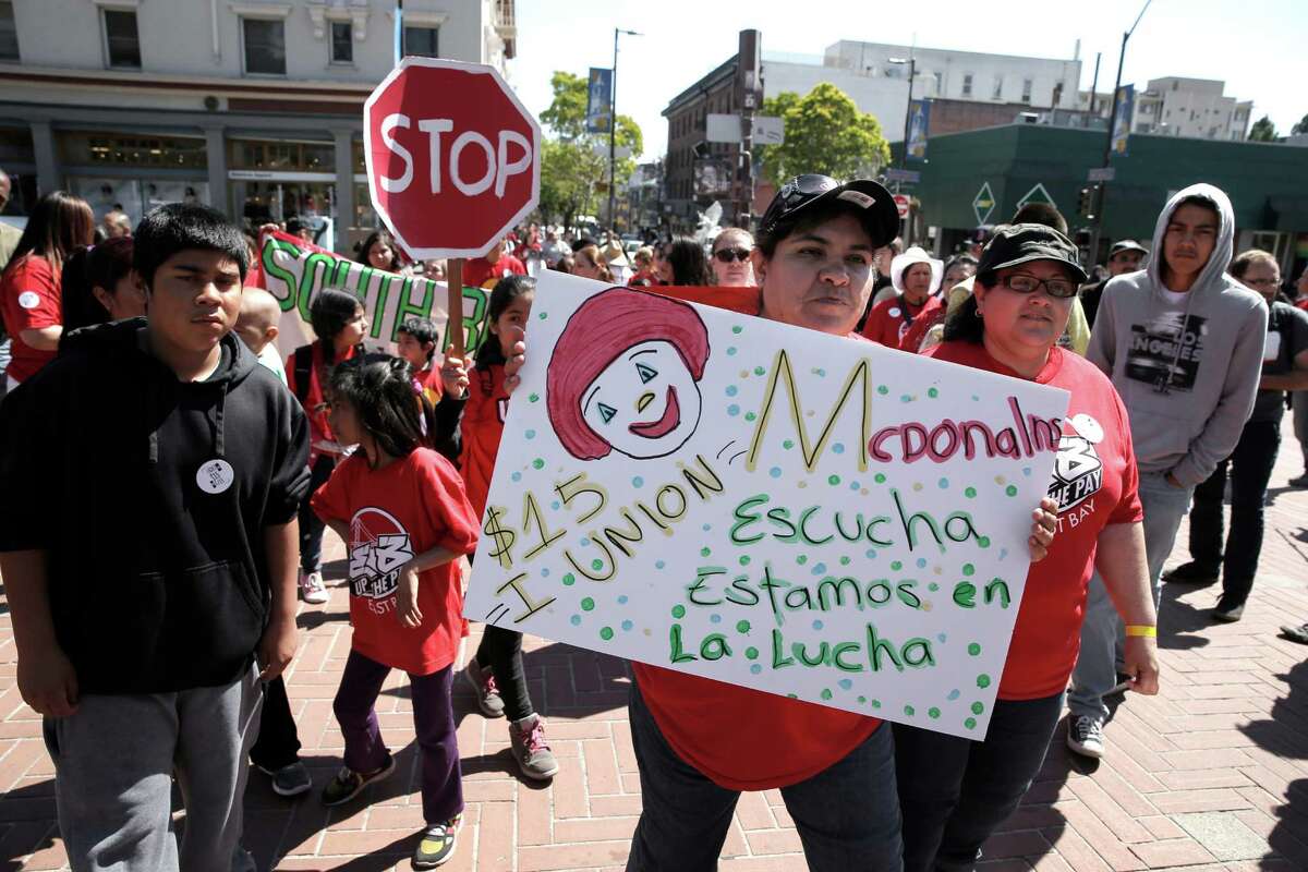 Taco Bell worker Veronica Gonzales joins fellow fast food workers and supporters during a rally for a higher minimum wage near Sproul Plaza on the UC Berkeley campus in Berkeley, Calif., on Wed. April 15, 2015.