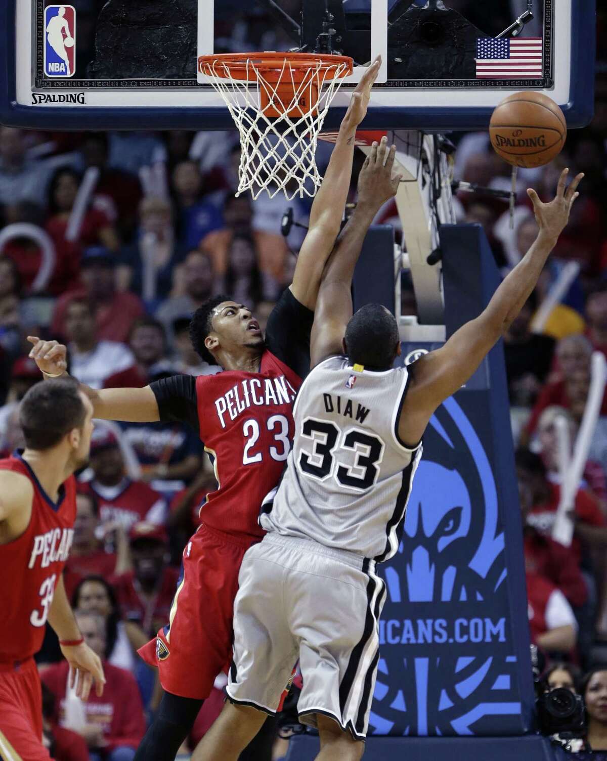 Antonio Spurs center Boris Diaw (33) goes to the basket against New Orleans Pelicans forward Anthony Davis (23) in the first half of an NBA basketball game in New Orleans, Wednesday, April 15, 2015. (AP Photo/Gerald Herbert)San