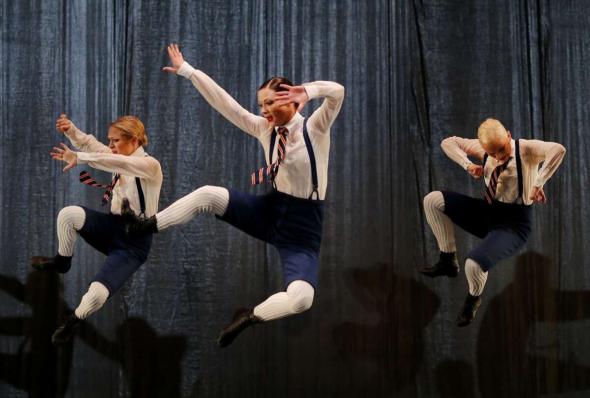 Dancers pose in the air during a scene from "The Word" Wednesday April 15, 2015. The famous Paul Taylor Dance Company performs their "The Word" composition at the Yerba Buena Center for the Arts Theatre in San Francisco, Calif.