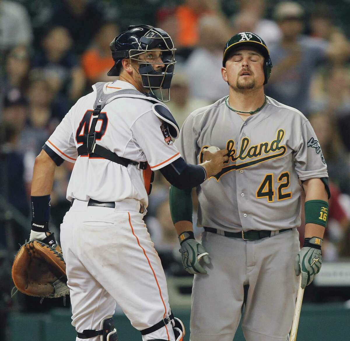 HOUSTON, TX - APRIL 15: Billy Butler of the Oakland Athletics reacts as Jason Castro of the Houston Astros tags him out on an appeal to first base umpire Mike Everitt in the eighth inning at Minute Maid Park on April 15, 2015 in Houston, Texas. All Major League Baseball players are wearing #42 today in honor of Jackie Robinson Day. (Photo by Bob Levey/Getty Images)