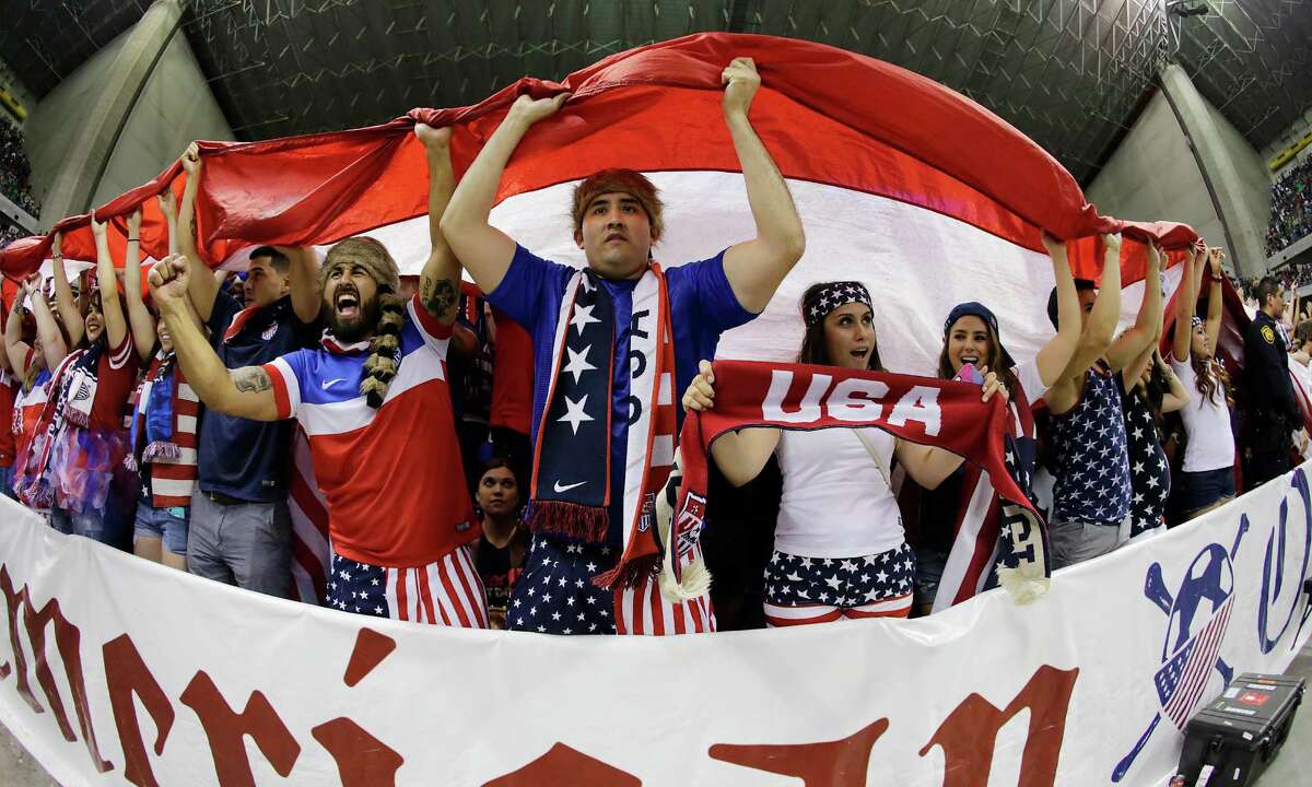 Fans celebrate in the closing moments as the United States team defeats Mexico during the international friendly soccer match at the Alamodome on Wednesday, Apr. 15, 2015. The U.S. team defeated Mexico, 2-0.