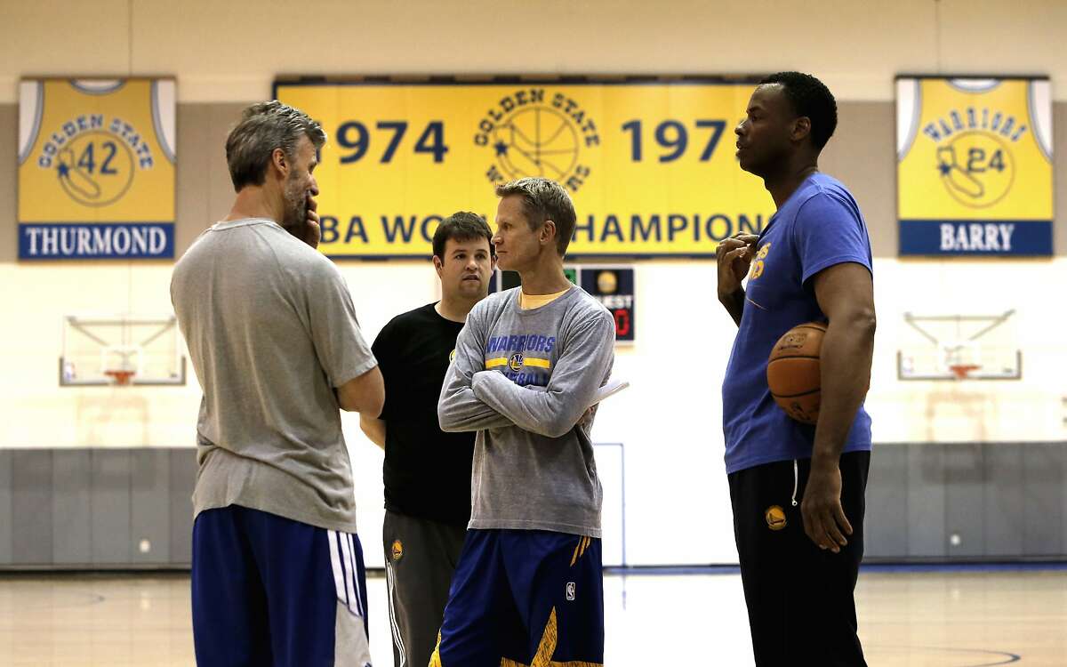 Head Coach Steve Kerr, (center) gets set for practice after the Golden State Warriors NBA basketball team held a media availability at their practice facility in Oakland, Calif., on Thurs. April 16, 2015, in preparation for the upcoming playoffs.