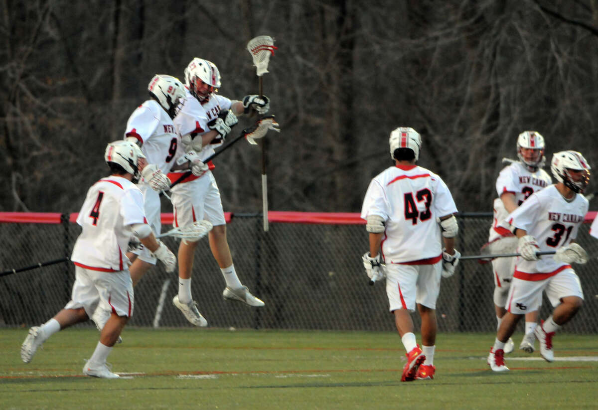 New Canaan Rams celebrate a goal as they host the Brunswick Bruins in a boys lacrosse game in New Canaan, Conn., April 16, 2015.