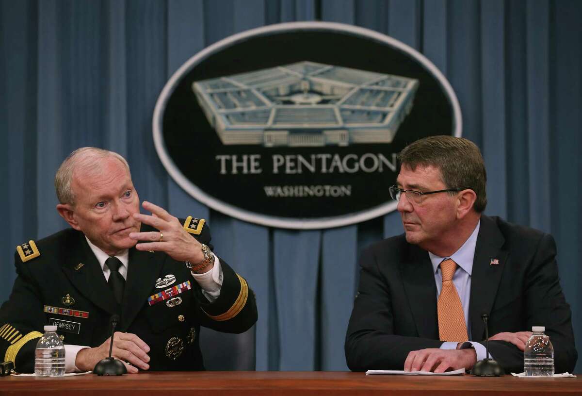 ARLINGTON, VA - APRIL 16: Joint Chiefs of Staff Martin Dempsey (L) and U.S, Secretary of Defense Ash Carter speak to the media during a briefing at the Pentagon April 16, 2015 in Arlington, Virginia. Secretary Carter talked about the situation in the middle-east including Iraq, Iran and Russia. (Photo by Mark Wilson/Getty Images)