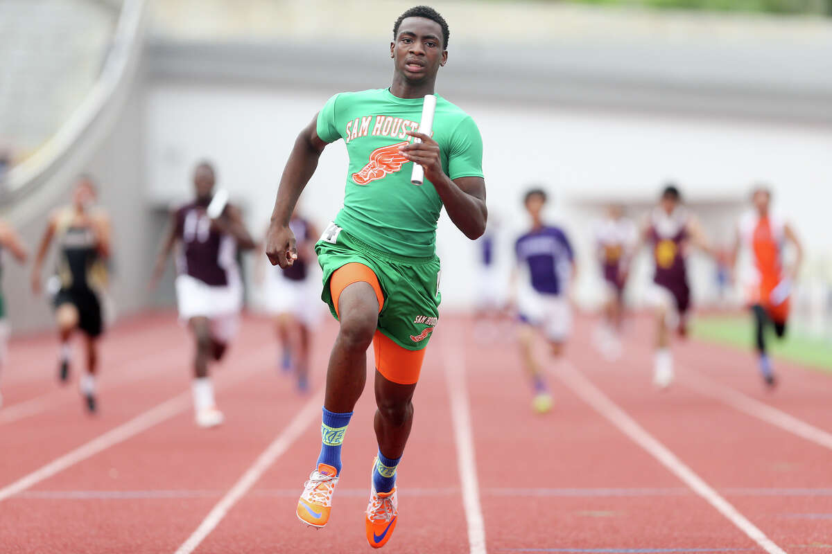 Sam Houston's Jonathan Challenger crosses the finish line of the 400-meter relay during the finals of the running events in the District 28-5A track and field meet at Alamo Stadium on Thursday, April 16, 2015. The Hurricanes won the event with a time of 42.14 seconds. MARVIN PFEIFFER/ mpfeiffer@express-news.net
