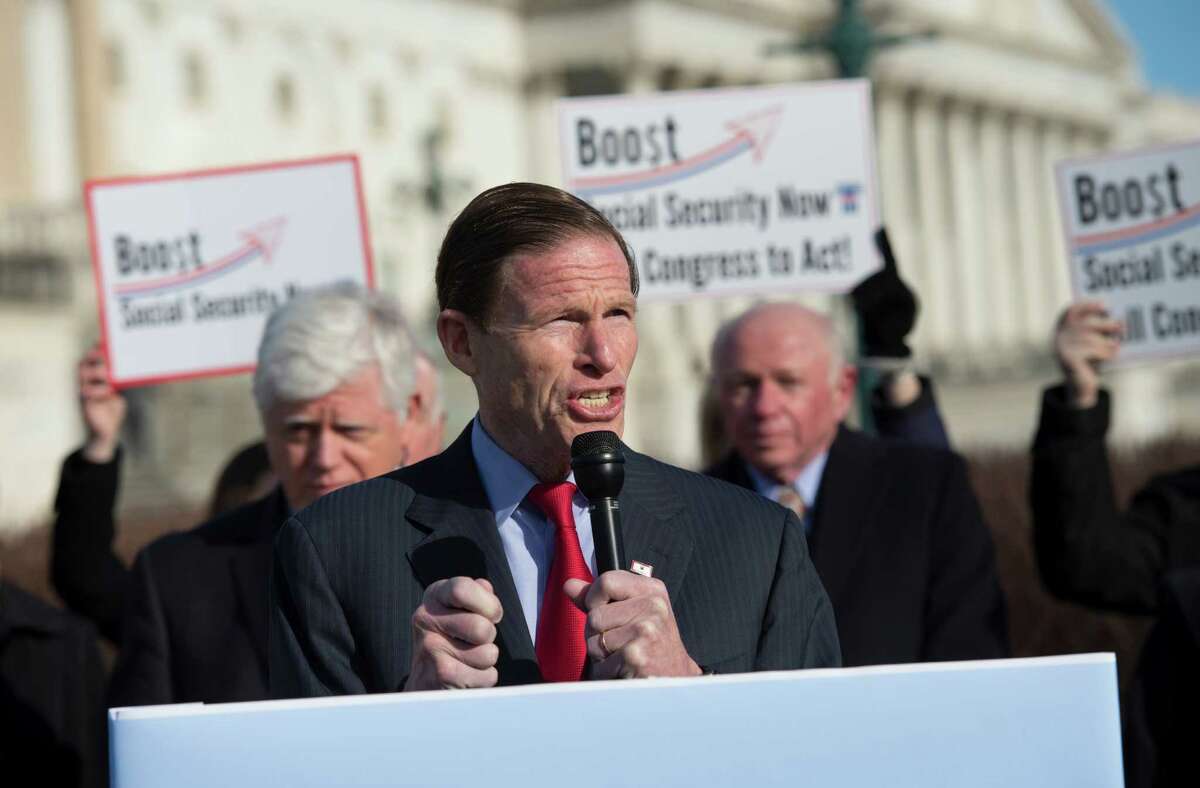 Sen. Richard Blumenthal, D-Conn., center, flanked by Rep. John Larson, D-Conn., left, and National Committee to Preserve Social Security & Medicare, President and CEO Max Richtman, speaks during a news conference on Capitol Hill in Washington, Wednesday, March 18, 2105, to announcement of the introduction of the Social Security 2100 Act.
