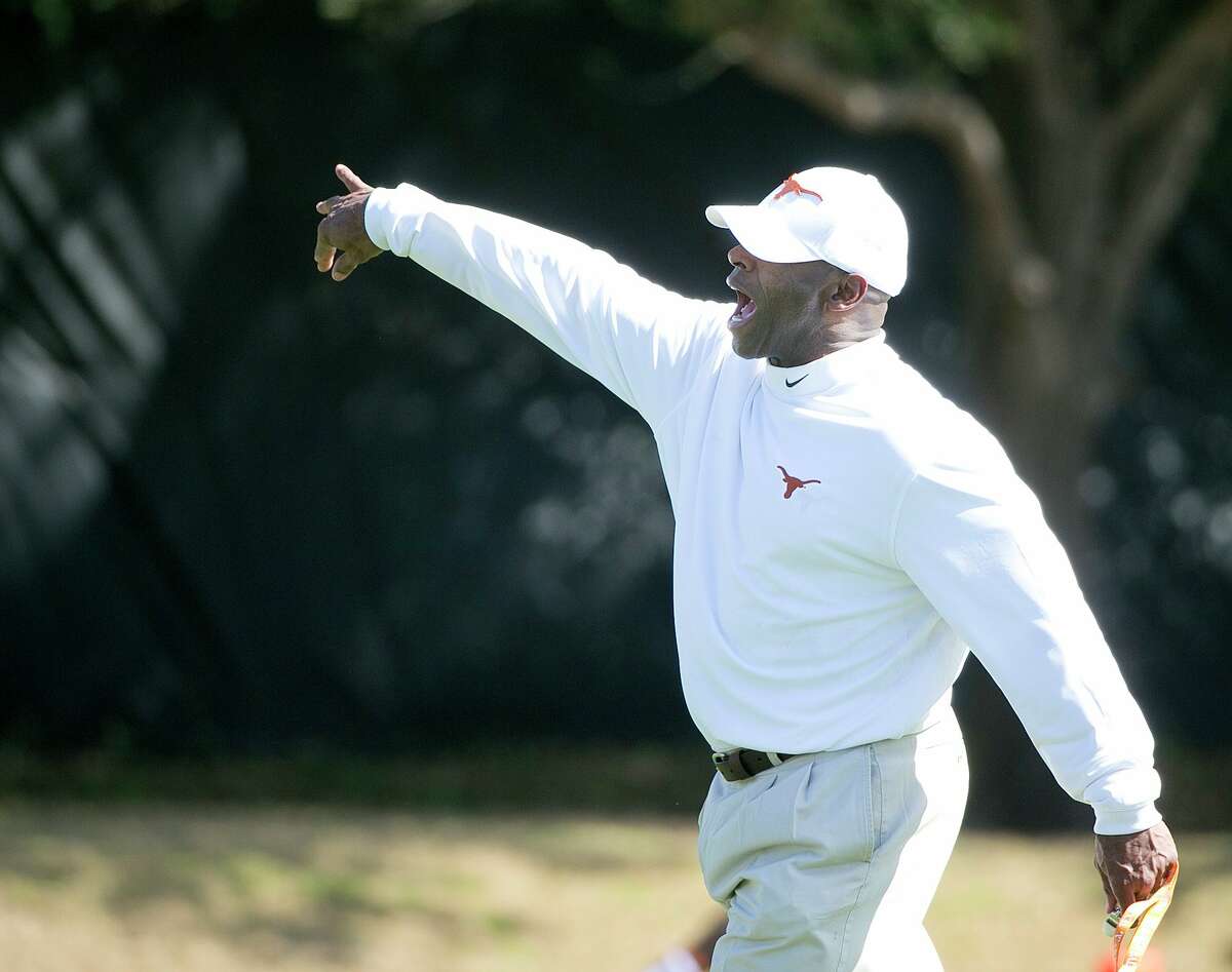 Coach Charlie Strong directs his players during a spring practice for Texas March 18, 2014.