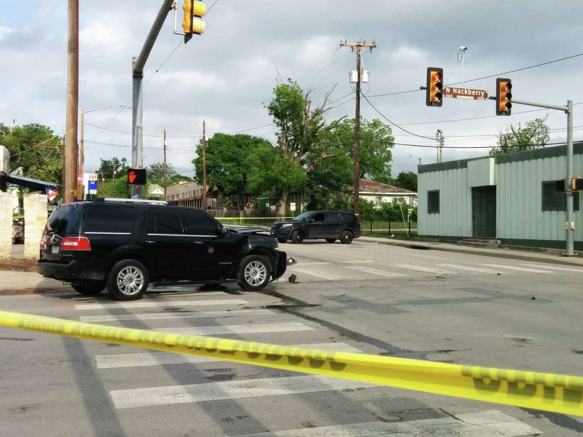 Police investigate the scene of a collision involving Mayor Ivy Taylor's SUV Saturday evening at the intersection of East Houston Street and North Hackberry.