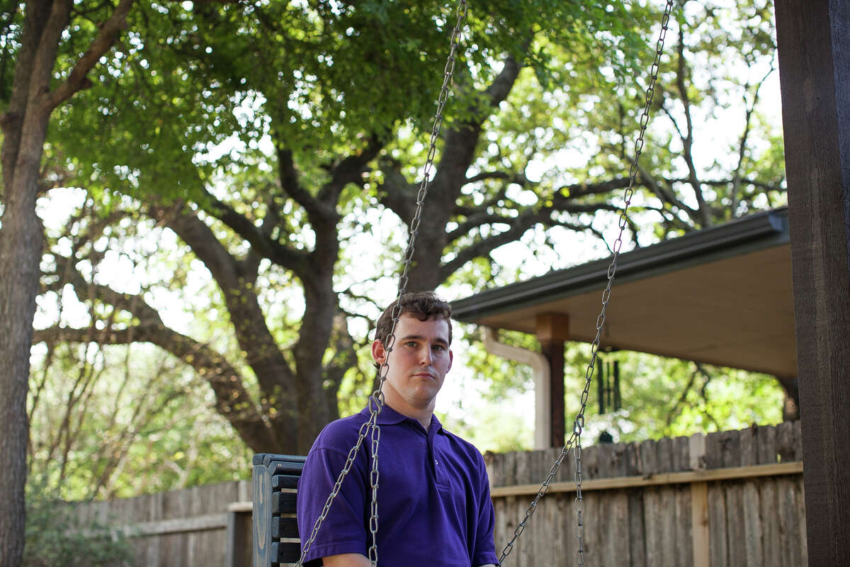 Zachariah Moccia, 24, swings in his backyard Friday April 3, 2015. Zach started having seizures at the age of two months, and is diagnosed with Dravet Syndrome. The non-euphoric cannabidiol oil has proven to treat intractable seizures, and Leslie hopes with the passing of the Texas Compassionate Use Act, House Bill 892 and Senate Bill 339, that Zach can soon receive the same help.