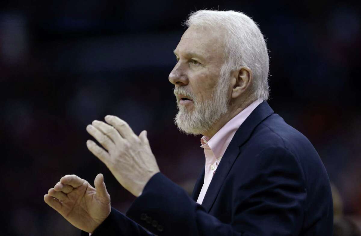 San Antonio Spurs head coach Gregg Popovich calls out rom the bench in the first half of an NBA basketball game against the New Orleans Pelicans in New Orleans, Wednesday, April 15, 2015. (AP Photo/Gerald Herbert)