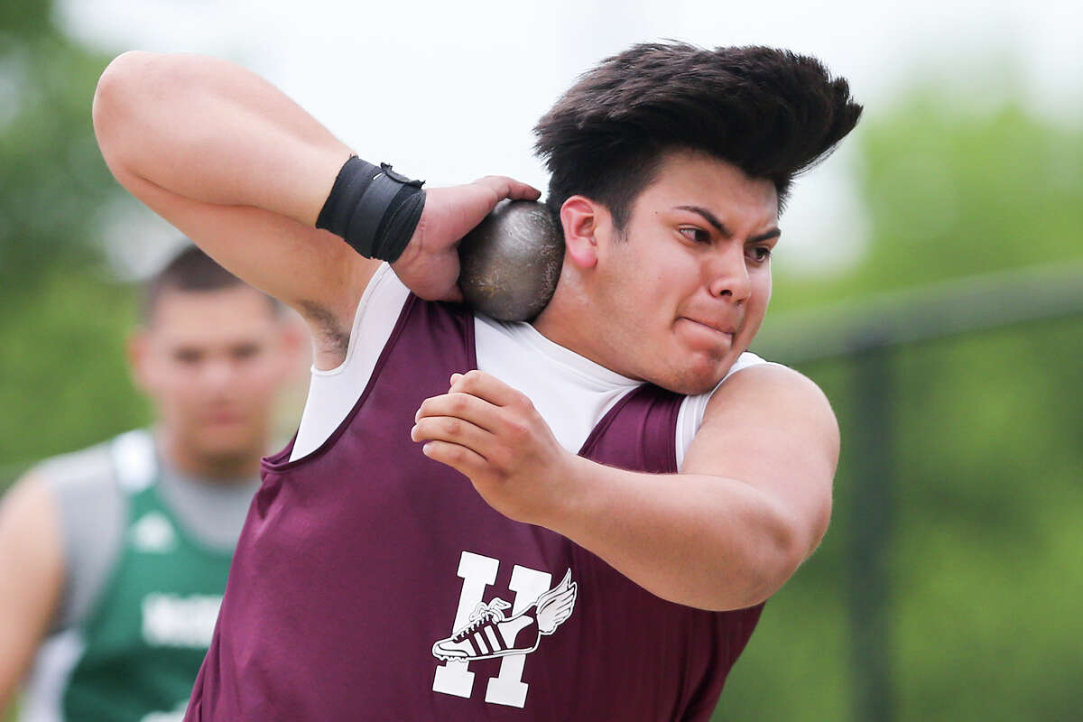 Harlandale's Andres Garcia winds up for a throw in the boys Shot Put during the District 28-5A track and field meet at Alamo Stadium on Wednesday, April 15, 2015. Garcia won the event with a personal best 56 feet, 1 and 1/2 inches. MARVIN PFEIFFER/ mpfeiffer@express-news.ne