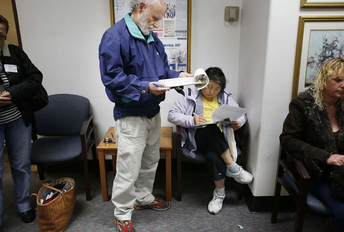 On the last day full day of operation at Doctors Medical Center, Walker Laid and his wife Mitsuko Laird fill out paper work to retrieve their medical records from the hospital on Monday April 2, 2015 in San Pablo, Calif. The records depart will stay open till at least the end of May.