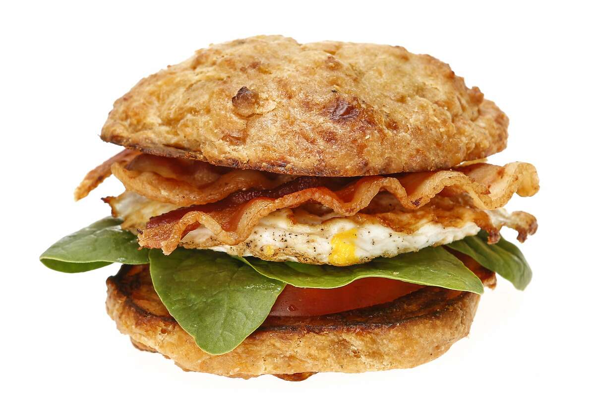 A Cheddar Chiptole Scone with tomato, spinach, egg and bacon, a recipe from L'Acajou Bakery and Cafe, is seen on Monday, April 20, 2015 in San Francisco, Calif.