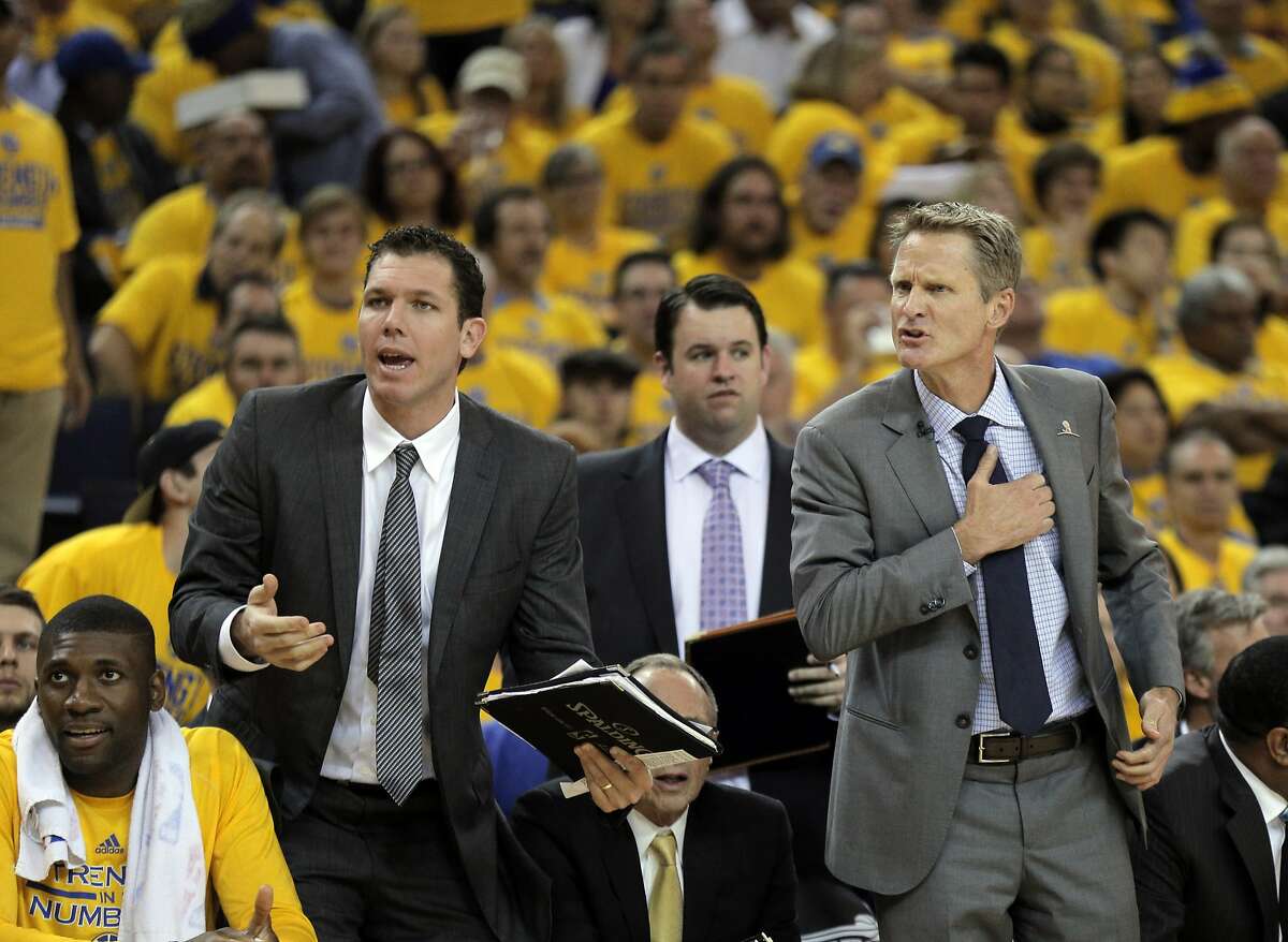 Head coach Steve Kerr and coach Luke Walton question a call after Klay Thompson was pulled out of bounds during the first half. The Golden State Warriors played the New Orleans Pelicans in Game 2 of the 1st Round of NBA Western Conference Playoffs at Oracle Arena in Oakland, Calif., on Monday, April 20, 2015.
