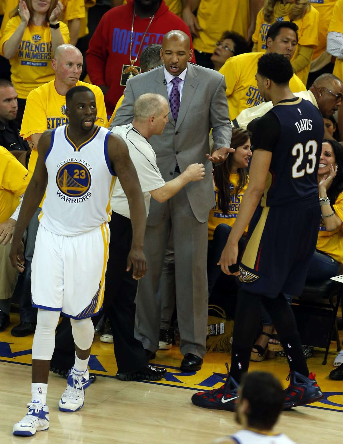 New Orleans Pelicans' head coach Monty Williams and Anthony Davis question official's call in 4th quarter of 97-87 loss to Golden State Warriors during Game 2 of the 1st Round of NBA Western Conference Playoffs at Oracle Arena in Oakland, Calif., on Monday, April 20, 2015.