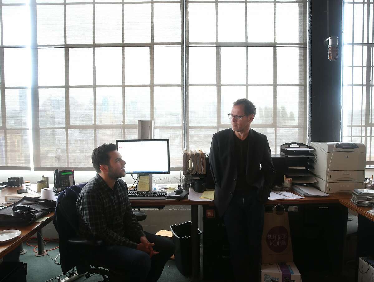 John Peterson (right), founder and president of Public Architecture, confers with Zach Reisler in the non-profit's office space in San Francisco, Calif. on Tuesday, April 21, 2015.