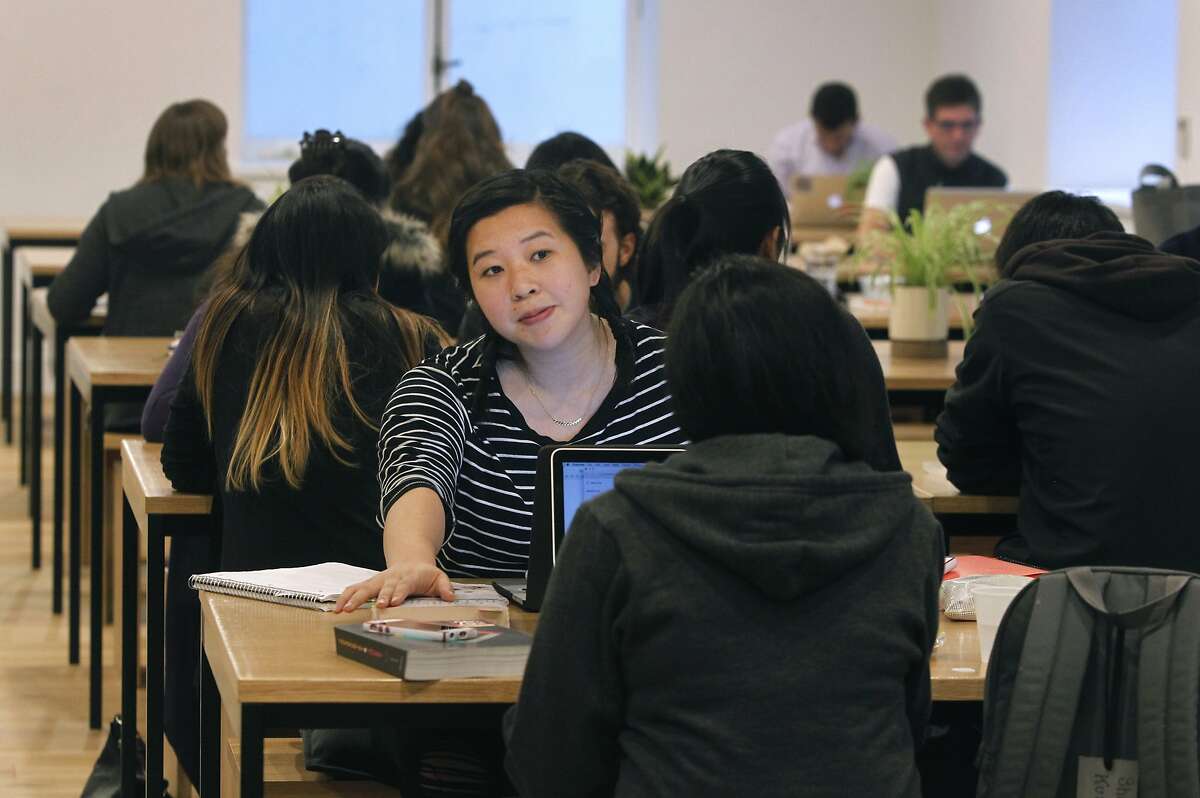 Students and others relax in a lunch area at the General Assembly campus on Bush Street in San Francisco, Calif. on Tuesday, April 21, 2015.